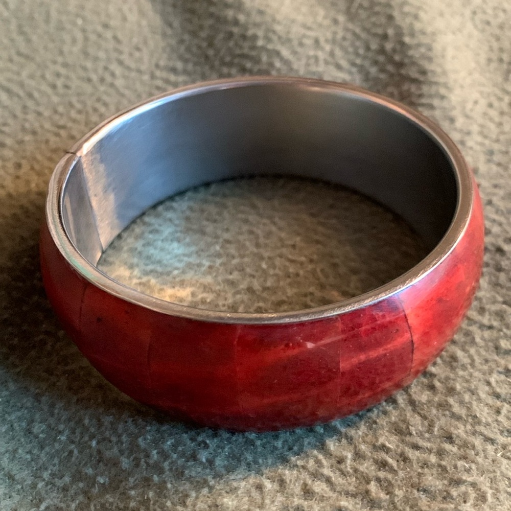 Pier 1 red and silver bracelet. Approximately 2 3/4 inches across.